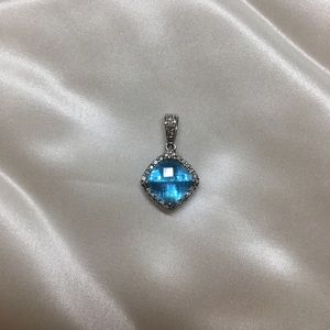 Topaz set in 14k white gold (stamped on the bail)